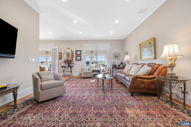 living room featuring ornamental molding and hardwood / wood-style floors