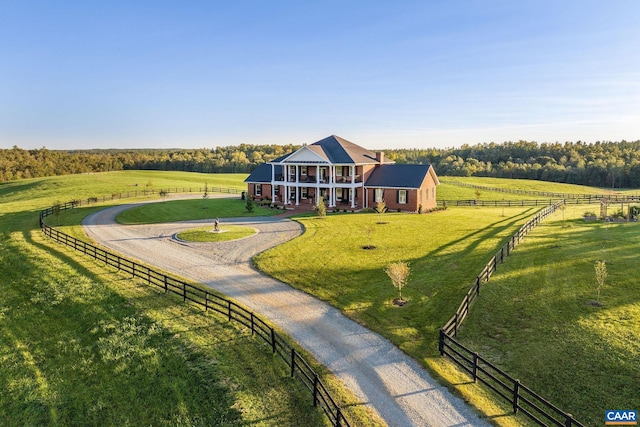 exterior space with a yard and a rural view