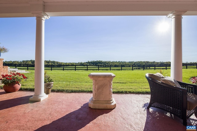 view of patio / terrace with a rural view