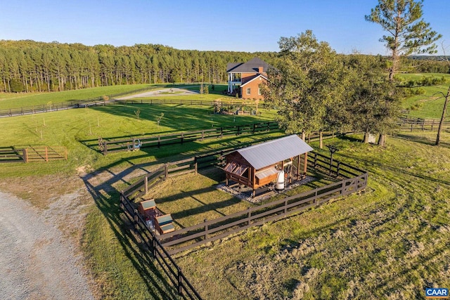 birds eye view of property featuring a rural view