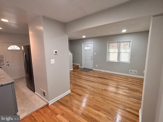 foyer with light hardwood / wood-style flooring