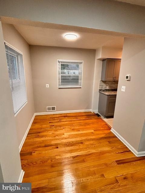 unfurnished dining area with light hardwood / wood-style floors