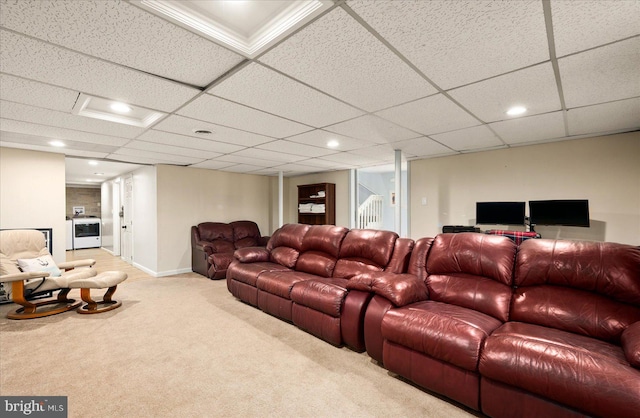 living room with light colored carpet and a paneled ceiling