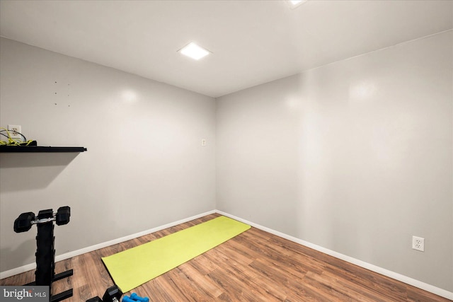 workout room with wood-type flooring