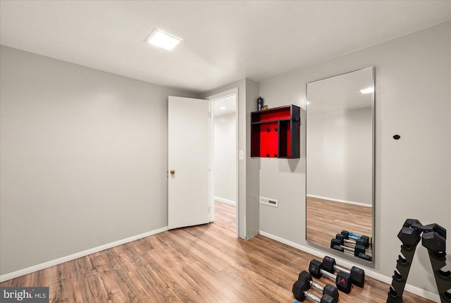 702 Ocean Pkwy, Ocean Pines, MD 21811 - exercise area with wood finished floors and baseboards