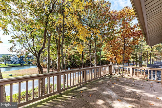 wooden deck featuring a water view