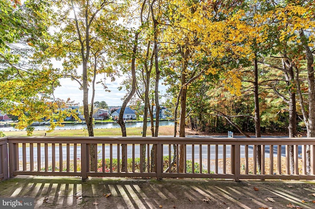 wooden terrace with a water view