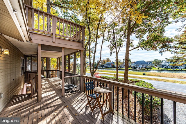 wooden deck with a water view