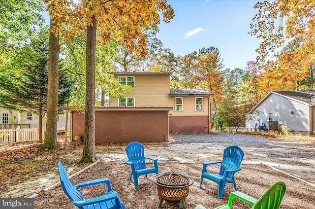 back of property featuring a fire pit