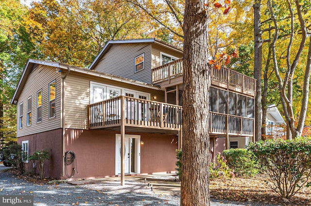 back of house featuring a balcony