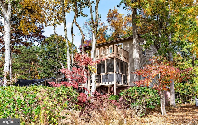 rear view of house featuring a balcony