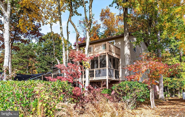 702 Ocean Pkwy, Ocean Pines, MD 21811 - back of property featuring a sunroom and a balcony