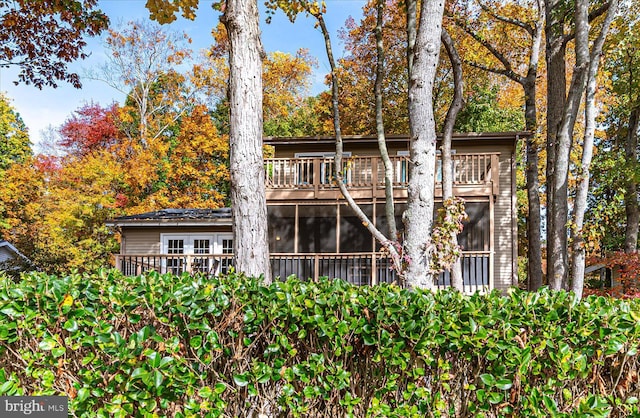 702 Ocean Pkwy, Ocean Pines, MD 21811 - rear view of property with a balcony and a sunroom