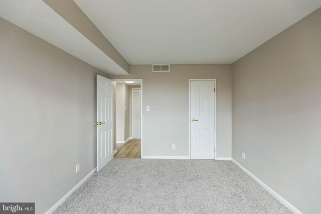 unfurnished bedroom with light carpet