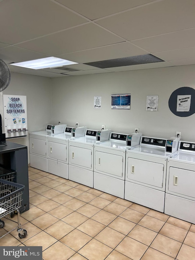 washroom featuring washer and dryer and light tile patterned floors