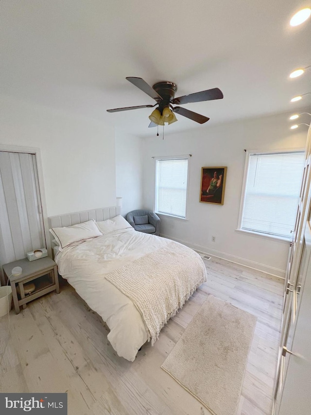 bedroom featuring ceiling fan and light hardwood / wood-style floors