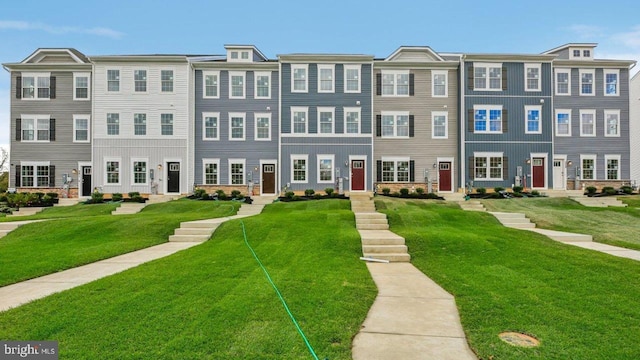 view of property featuring a front yard