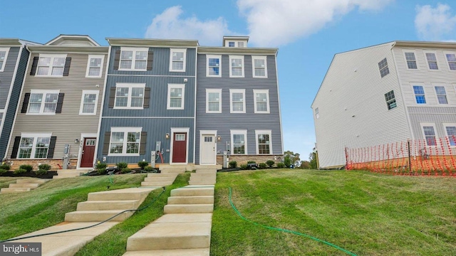 view of property featuring a front yard