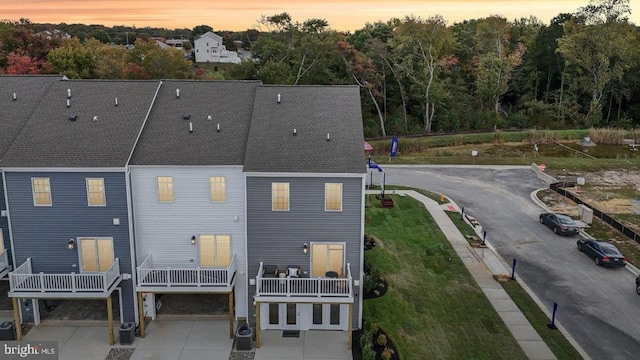 view of back house at dusk