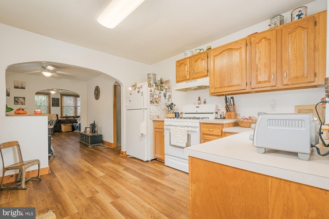 kitchen featuring white appliances, ceiling fan, and light wood-type flooring