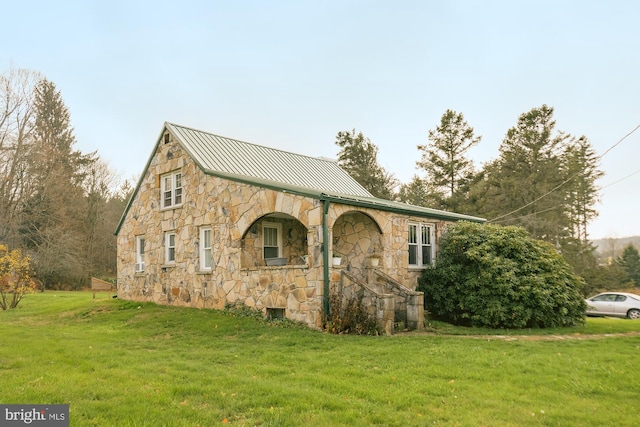 117 Accident Bittinger Rd, Accident, MD 21520 - view of home's exterior with stone siding, a lawn, a standing seam roof, and metal roof