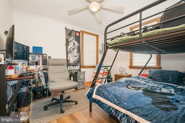 bedroom featuring hardwood / wood-style floors and ceiling fan