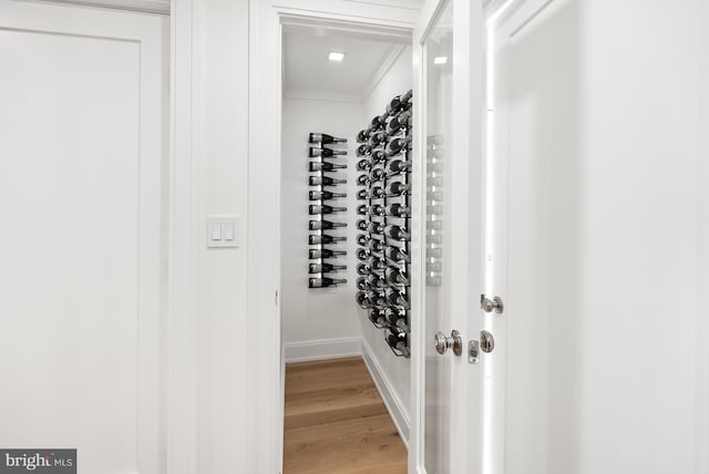 interior space with ornamental molding and light wood-type flooring