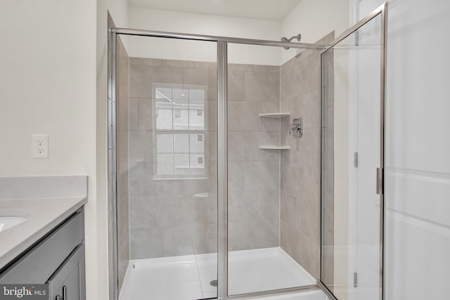 bathroom with vanity and an enclosed shower