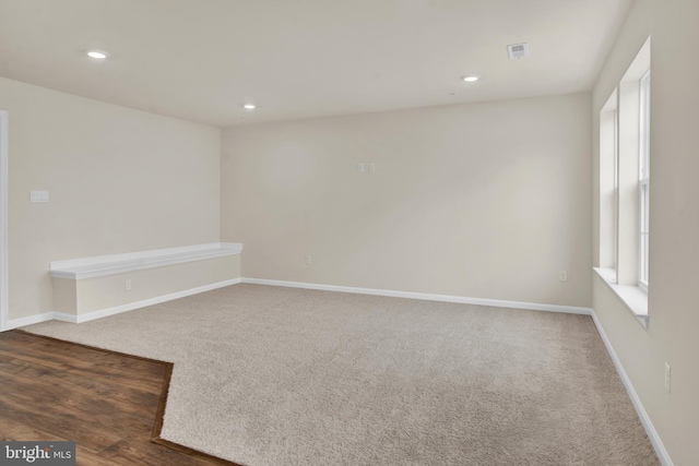 empty room with dark wood-type flooring