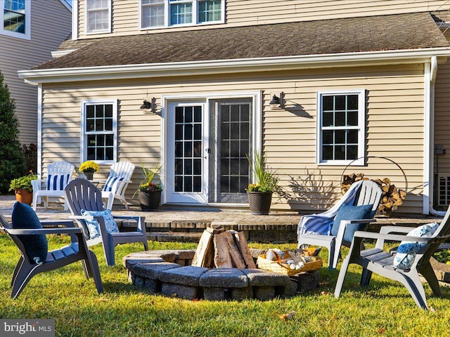 exterior space featuring french doors and an outdoor fire pit