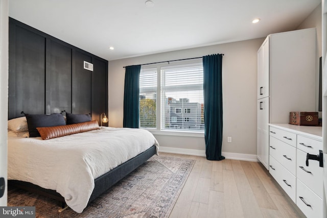 bedroom featuring light hardwood / wood-style floors