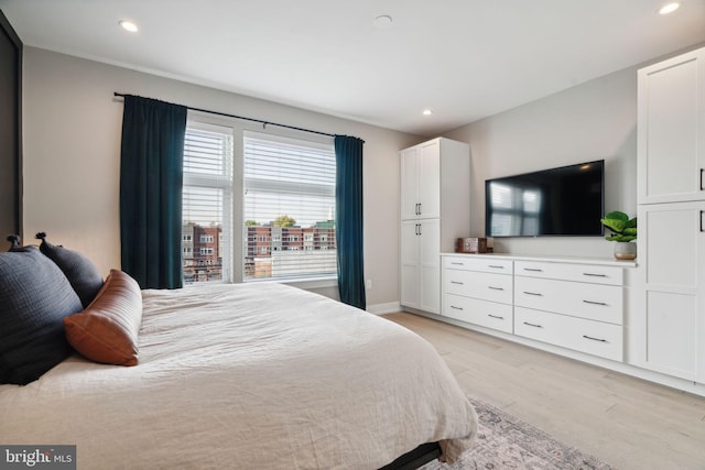 bedroom with light wood-type flooring