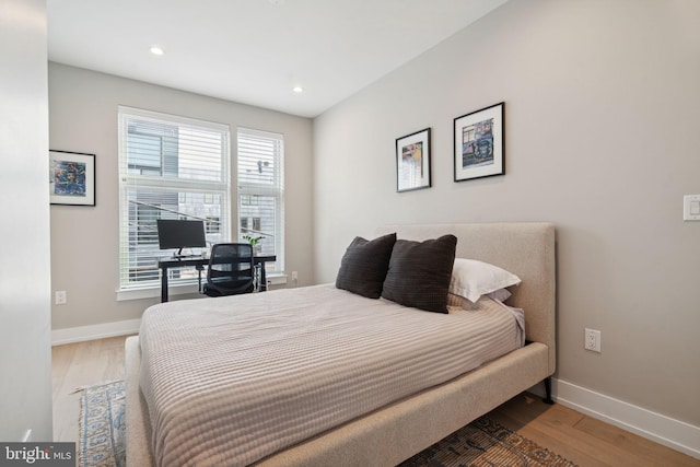 bedroom with hardwood / wood-style floors