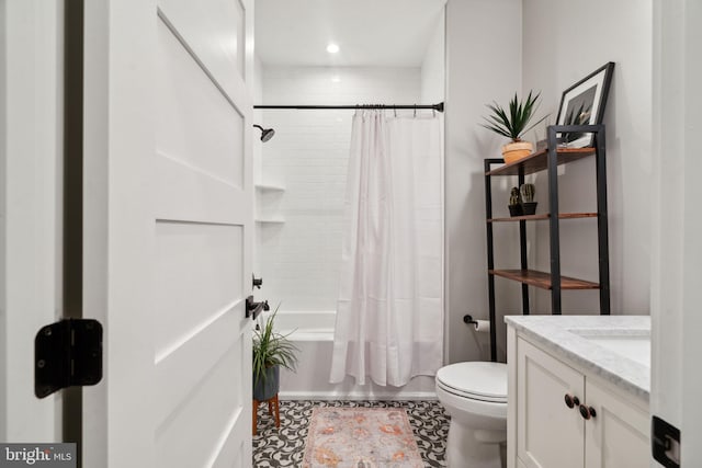 full bathroom featuring vanity, shower / bath combo, and toilet