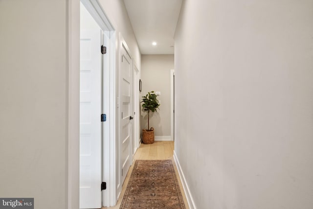 hall with light wood-type flooring