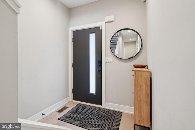 entrance foyer with light hardwood / wood-style floors