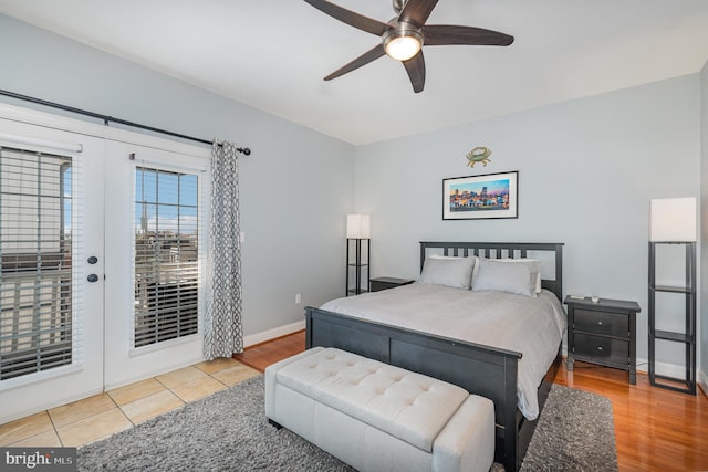 bedroom featuring hardwood / wood-style floors, ceiling fan, access to exterior, and french doors