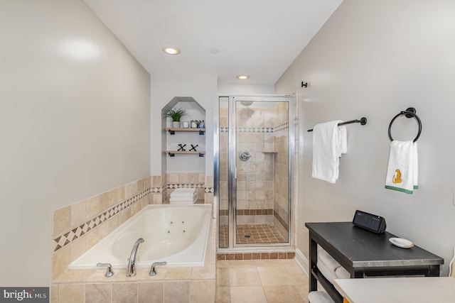 bathroom with tile patterned flooring and independent shower and bath