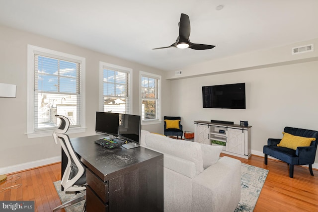 living room with plenty of natural light and light wood-type flooring