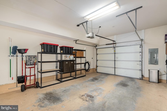 garage featuring a garage door opener and electric panel