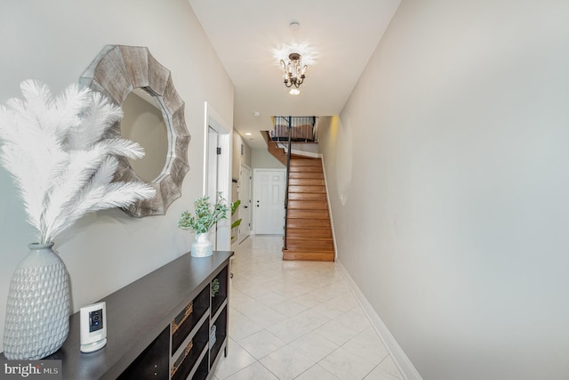 hallway featuring a chandelier