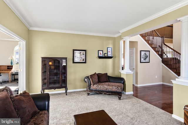 living room with dark hardwood / wood-style floors, ornate columns, and ornamental molding