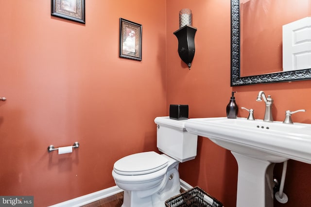 bathroom with sink and toilet