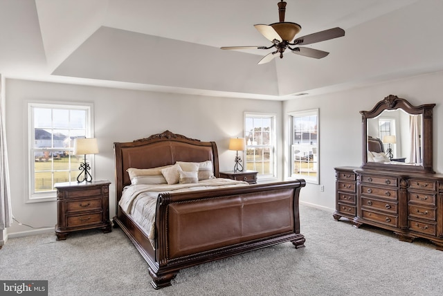 bedroom with ceiling fan and light carpet