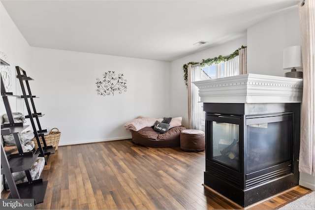 bedroom with dark hardwood / wood-style floors