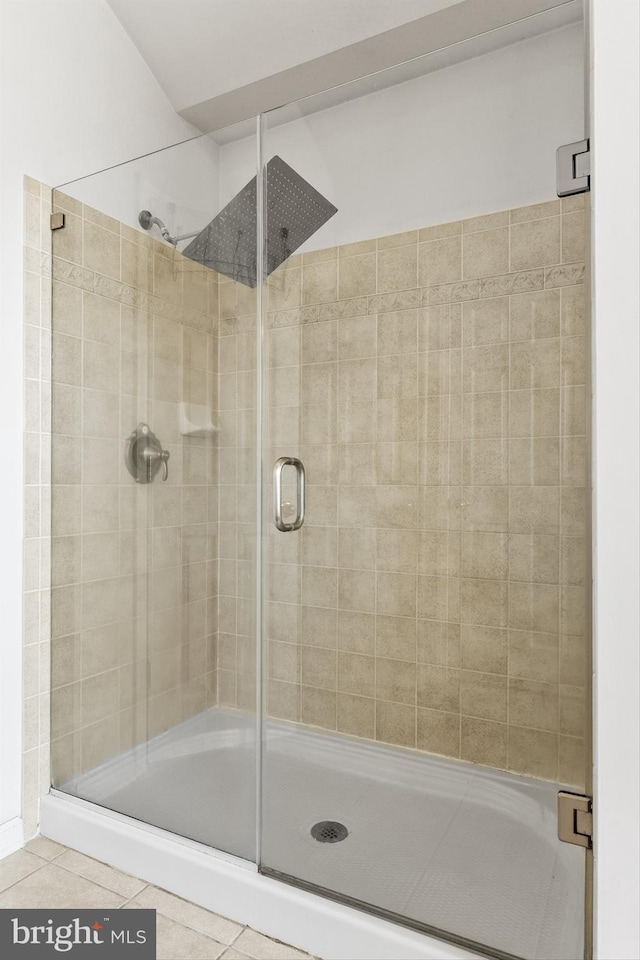 bathroom featuring tile patterned floors and an enclosed shower