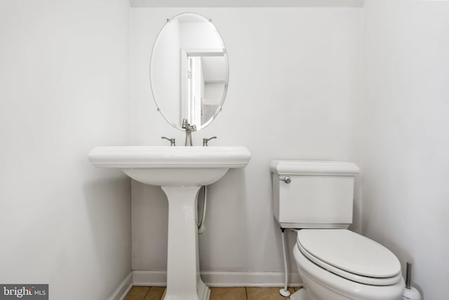 bathroom featuring tile patterned floors and toilet