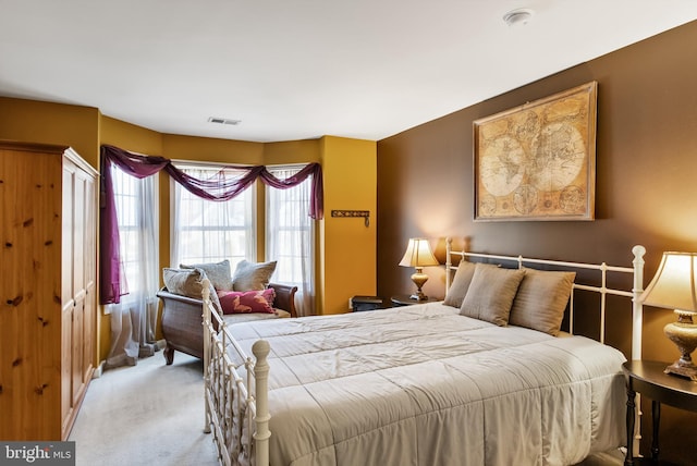 bedroom with light colored carpet