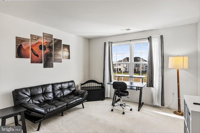 office area featuring light colored carpet