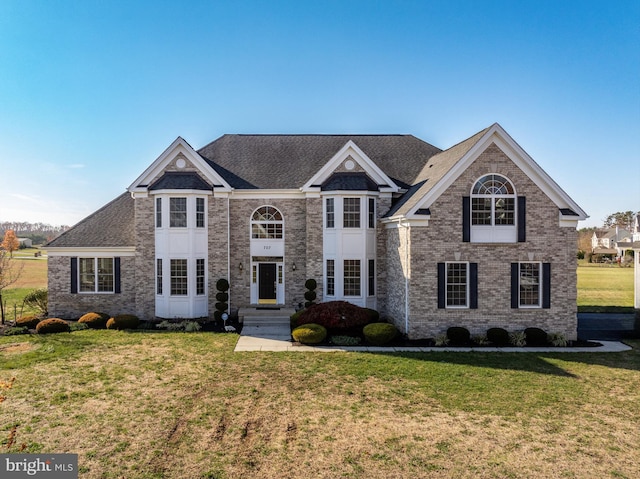 front facade with a front lawn